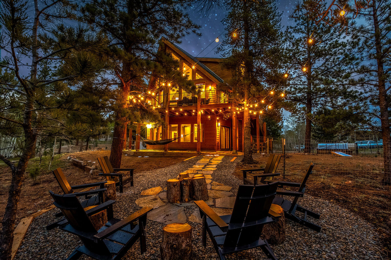 Cabin and fire pit at night